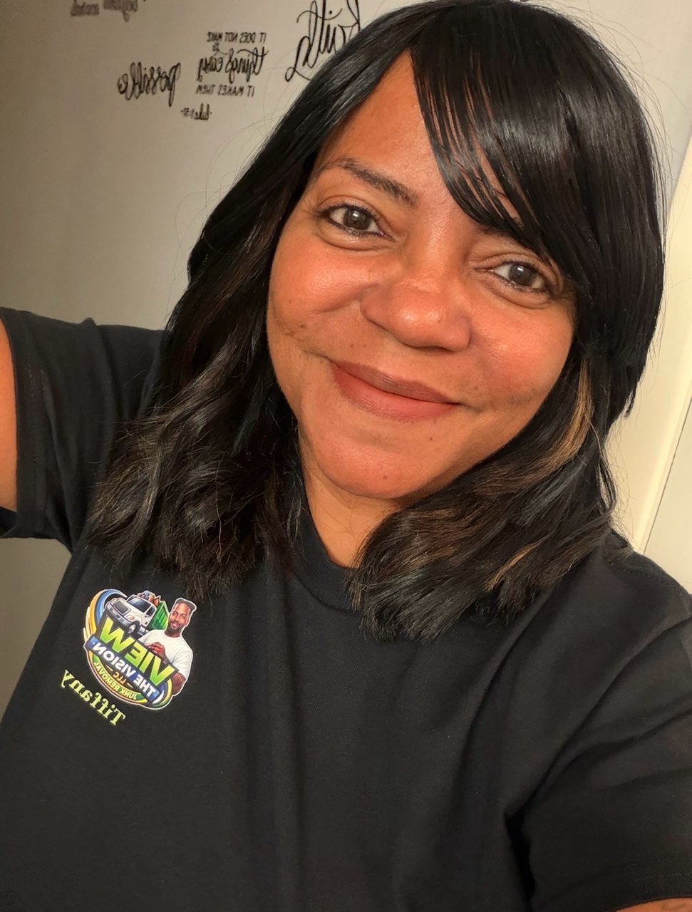 Tiffany, co-owner of View the Vision LLC, in a VIEW THE VISION tee